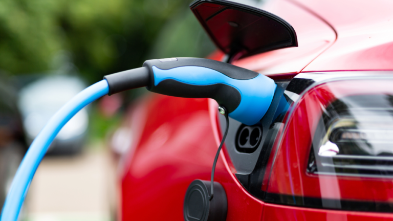 The Plug of a EV charger placed into its charging socket on a car